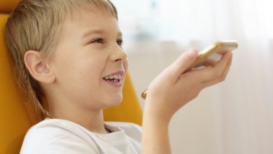 Boy makes voice search in smartphone